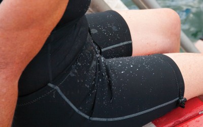 Person wearing Conni Containment Swim Shorts stepping out of pool